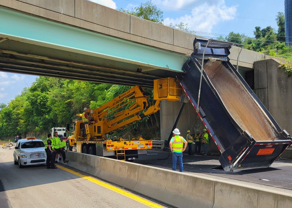 Dump truck strikes overpass on Route 40 in California - Herald-Standard